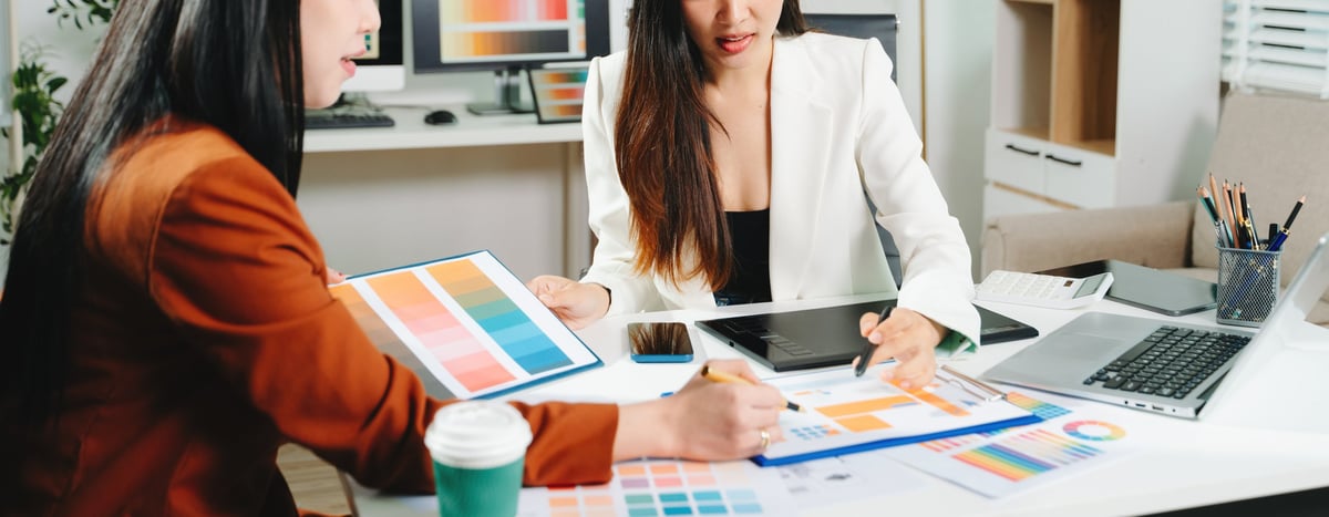 Two designers choosing a color palette for a client website