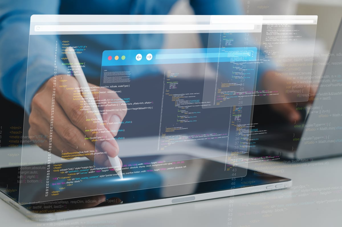 Web developer working on a tablet with code and design interfaces